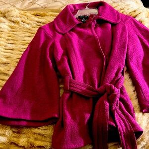 Spring/Fall, hip length lined jacket with belt. No pockets.